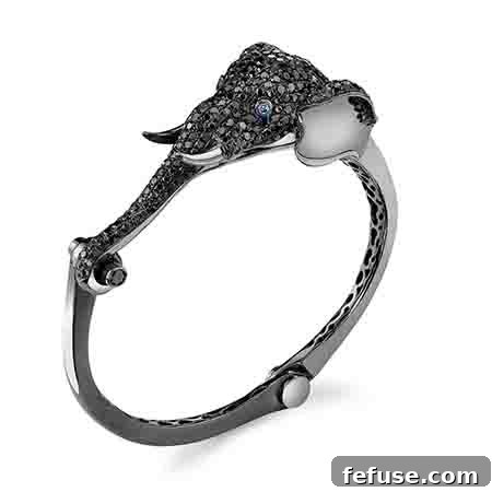 Elephant cuff in 18k gold with black rhodium, diamonds, and blue sapphires by Borgioni