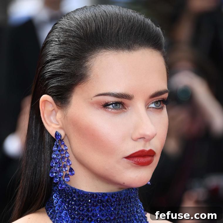Cannes 2019 Jewellery Dazzles 2 Brazilian model Adriana Lima wearing Chopard's Red Carpet Collection earrings with tanzanites at Cannes Film Festival 2019