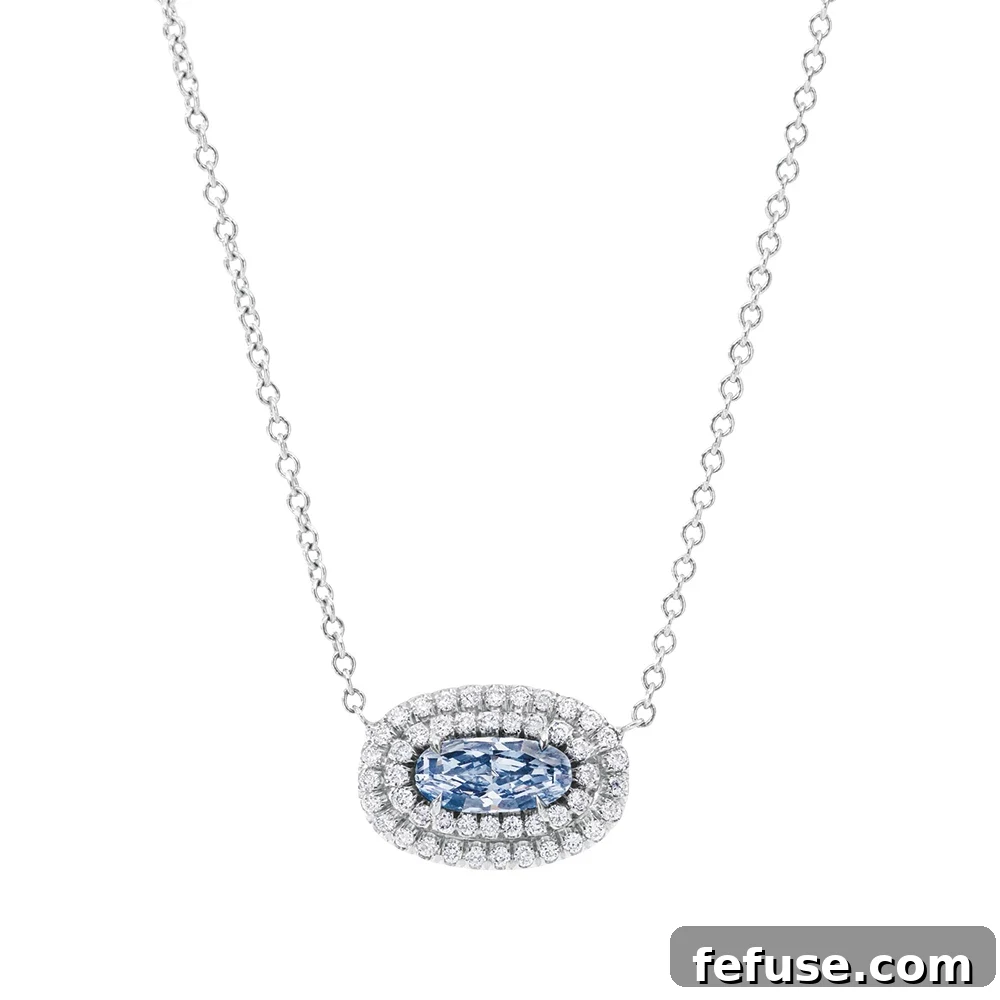 Fancy Intense Blue Diamond Pendant Necklace - Stephen Silver custom necklace with center Fancy Intense Blue SI1 oval mixed cut diamond, framed by colorless round diamonds in platinum.