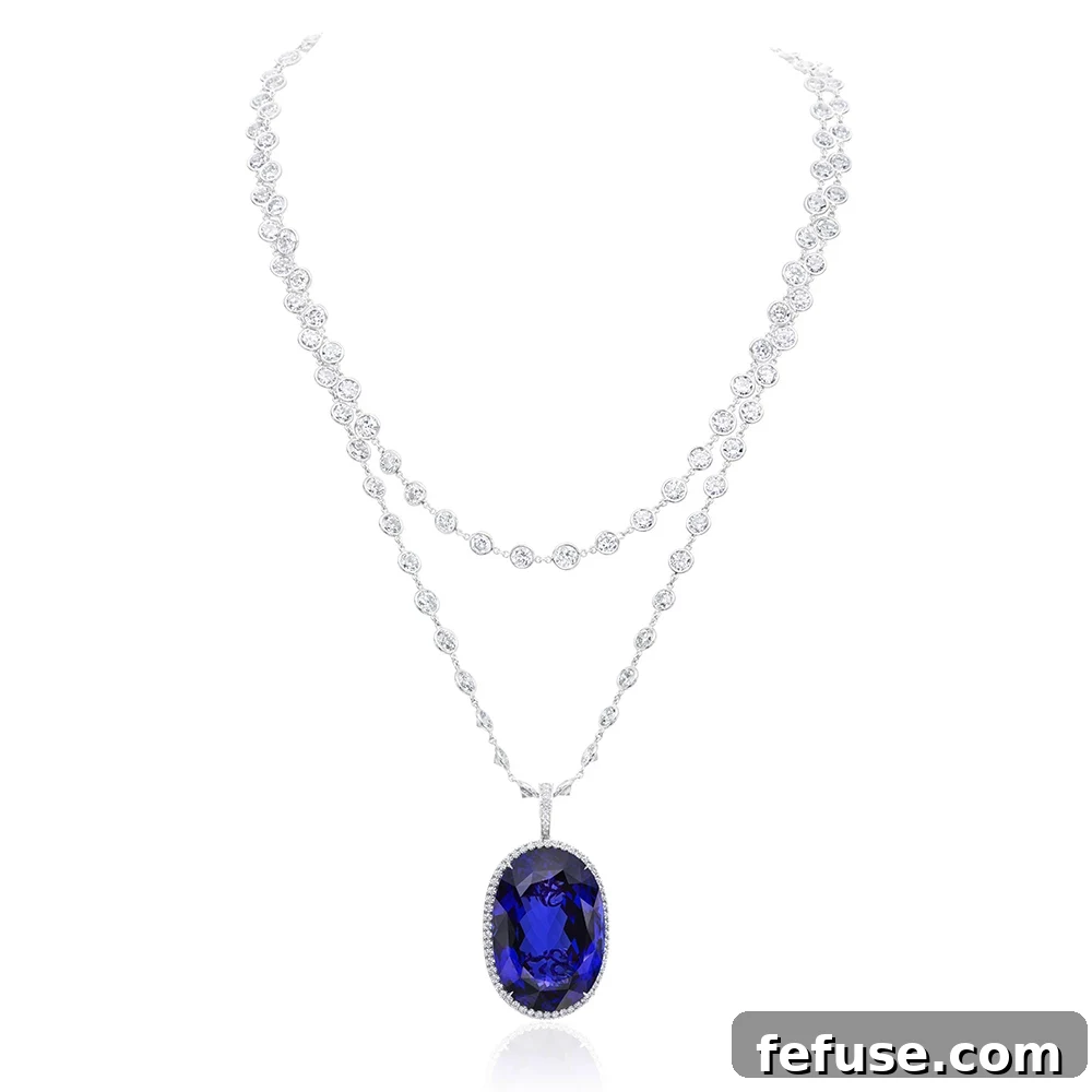Tanzanite Diamond Halo Pendant - Stephen Silver one-of-a-kind with 76.56-carat oval-cut tanzanite, vivid purplish-blue, pavé set diamonds in platinum with diamond chain.