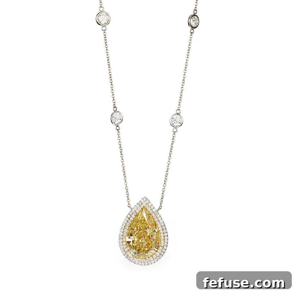 Fancy Intense Yellow Diamond Pendant - Stephen Silver custom-made 8.01 carat Fancy Intense Yellow Diamond pendant with pavé set and bezel set diamonds in platinum.