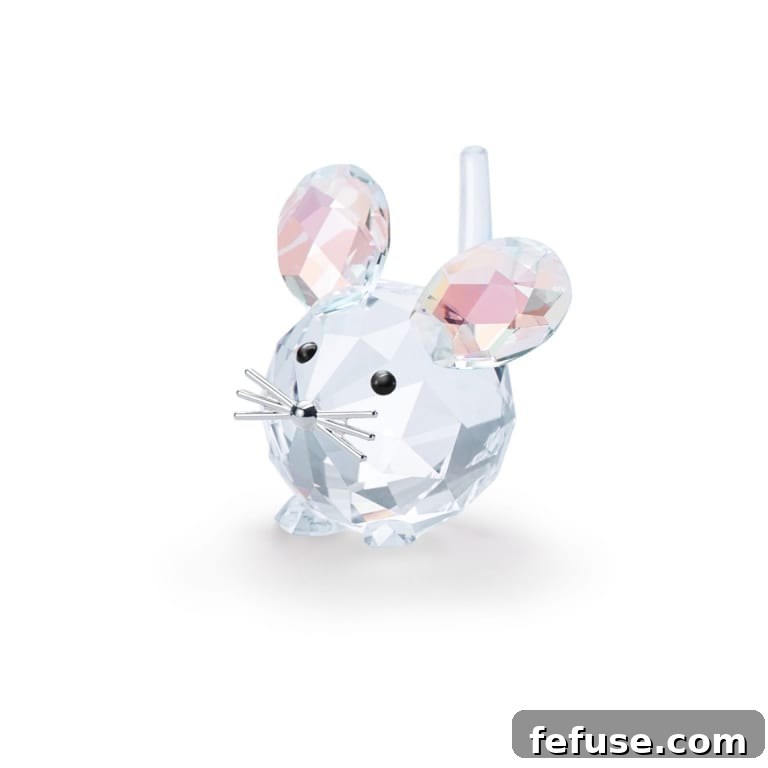 Swarovski crystal figurines arranged artfully, showcasing intricate designs and sparkling craftsmanship against a soft background.