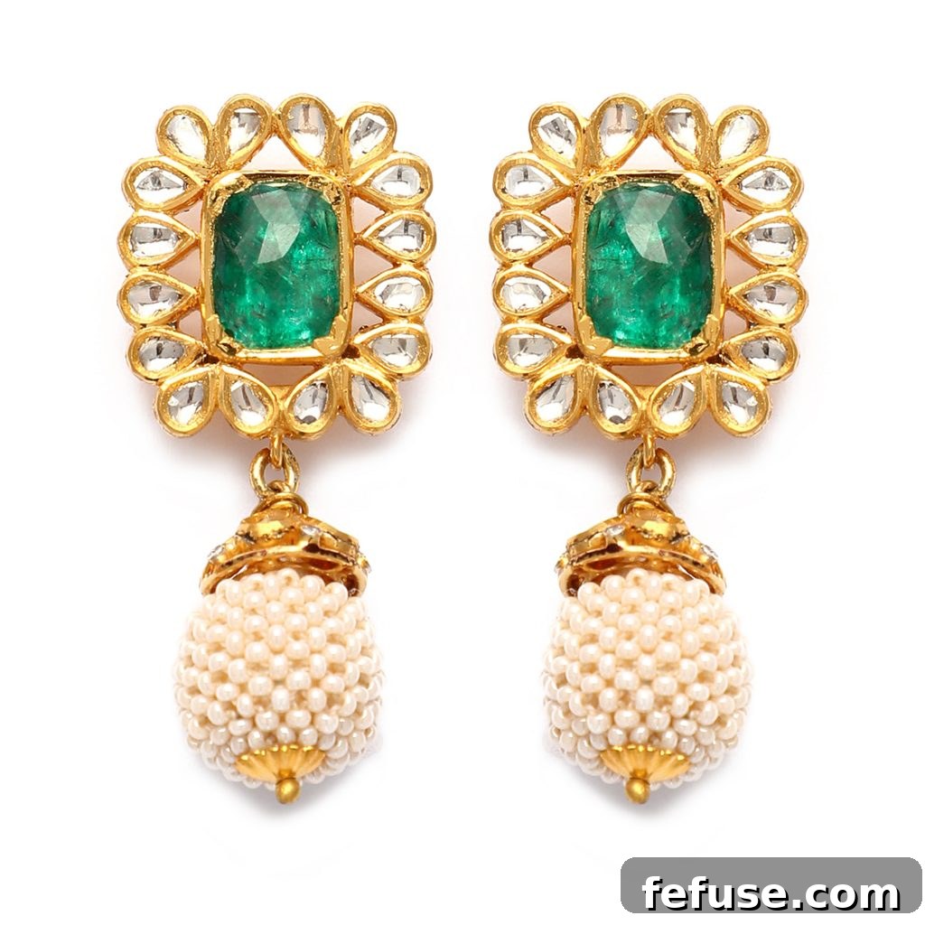 Subtly elegant Latique earrings featuring uncut diamonds set against emeralds, complemented by lustrous South Sea pearls.