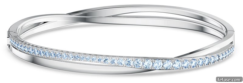 Celebrate Brilliance The New Swarovski 125th Anniversary Collection 2 Swarovski Twist Collection necklace and bracelet featuring blue and white crystals, elegantly displayed.