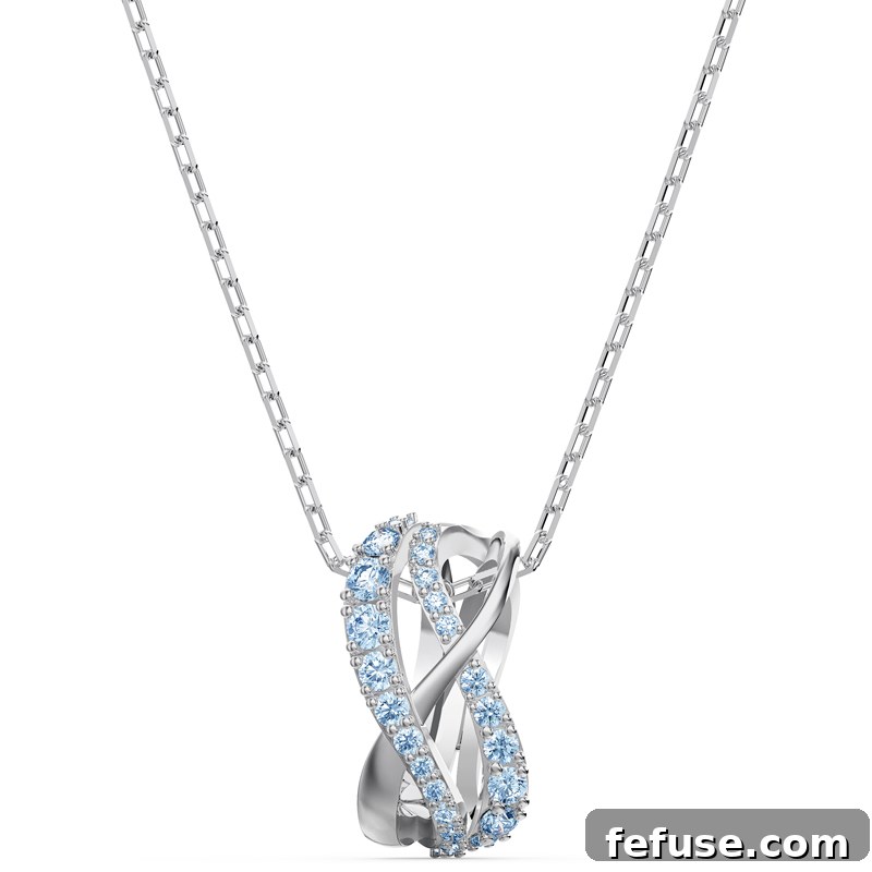 Celebrate Brilliance The New Swarovski 125th Anniversary Collection 4 Swarovski Twist Collection full set including necklace, earrings, ring, and bracelet displayed on a model, highlighting their collective allure.