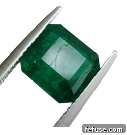 Damaged emerald gemstone losing astrological potency due to cracks or discoloration