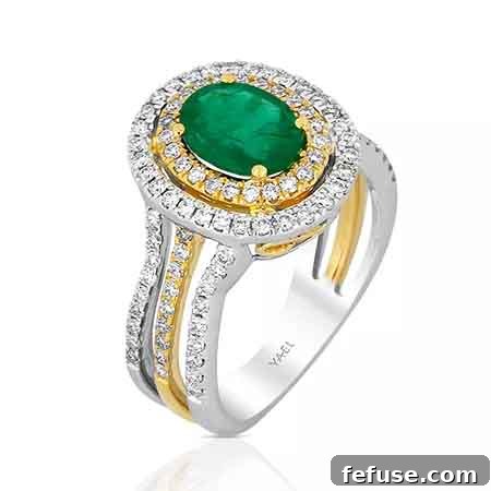 Elegant oval emerald engagement ring with diamond halo in 18k two-tone gold