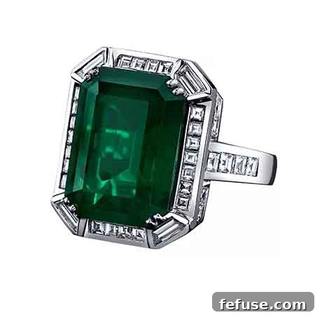Grand emerald-cut emerald engagement ring with square and trapezoid diamonds in platinum
