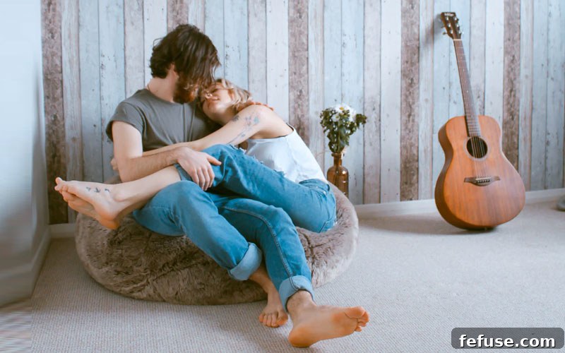 Couple embracing with engagement ring