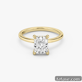 The Art of the Stack: Pairing Engagement Ring Shapes with the Perfect Wedding Band 5 The Classic Hidden Halo Ring in 18k Yellow Gold (Featuring a Radiant Cut Stone and Plain Band)