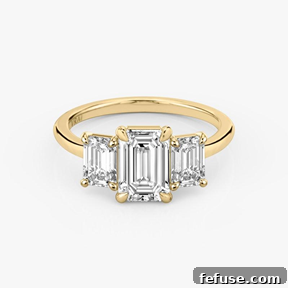 The Art of the Stack: Pairing Engagement Ring Shapes with the Perfect Wedding Band 6 The Three Stone Multi-Stone Ring in 18k Yellow Gold (Featuring Emerald Stones and a Plain Band)