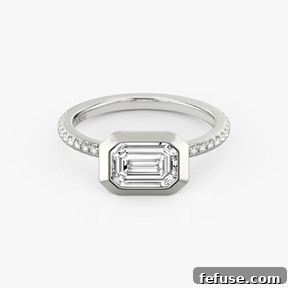 The Art of the Stack: Pairing Engagement Ring Shapes with the Perfect Wedding Band 8 The Signature Bezel Ring in Platinum (Featuring an Emerald Cut Stone and Pavé Band)