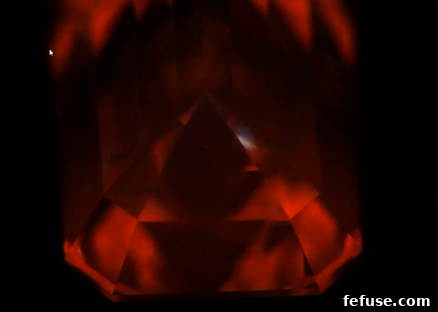 Fig.5. Intense red phosphorescence observed for milliseconds post UV excitation, quickly changing to yellow, a rare phenomenon in CVD diamonds.