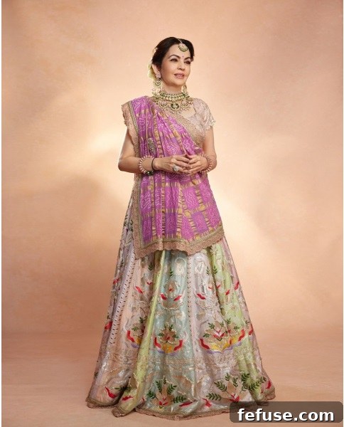 Nita Ambani wearing the lotus-inspired necklace and other jewellery accessories designed by Sunita Shekhawat.