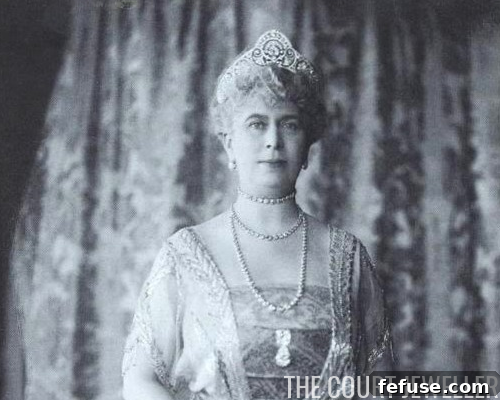 An archival illustration or photograph of Queen Mary's Honeysuckle Tiara, possibly in its original, taller configuration, showcasing the intricate diamond honeysuckle design.
