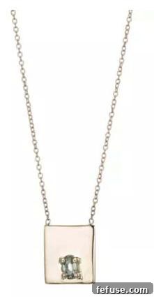 Drew necklace in 14k gold with a pale green sapphire