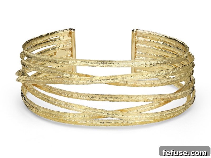 Luxurious 18 karat gold textured cuff bracelet, a perfect Valentine's Day gift from Blue Nile