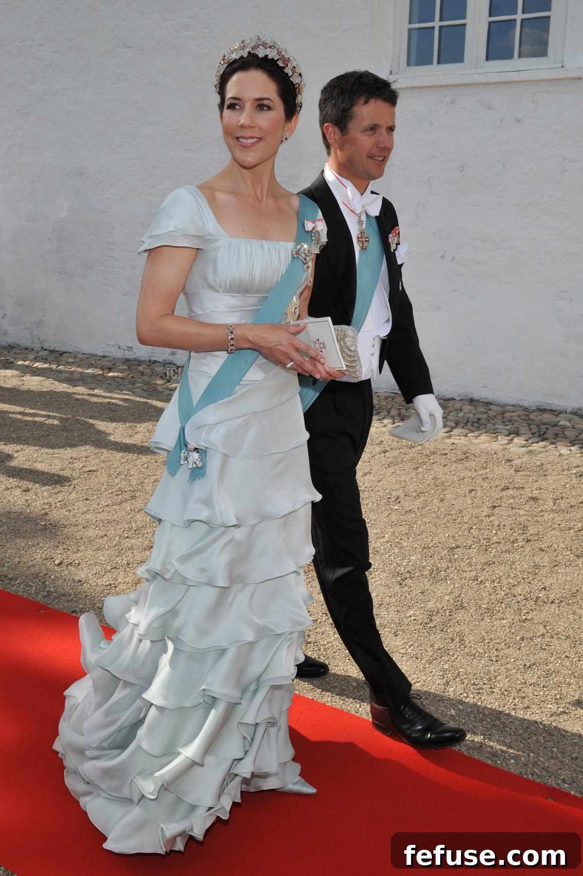 Crown Princess Mary of Denmark in an ice-blue gown, adorned with the Danish Ruby Parure and the Order of the Elephant, attending Prince Joachim's wedding