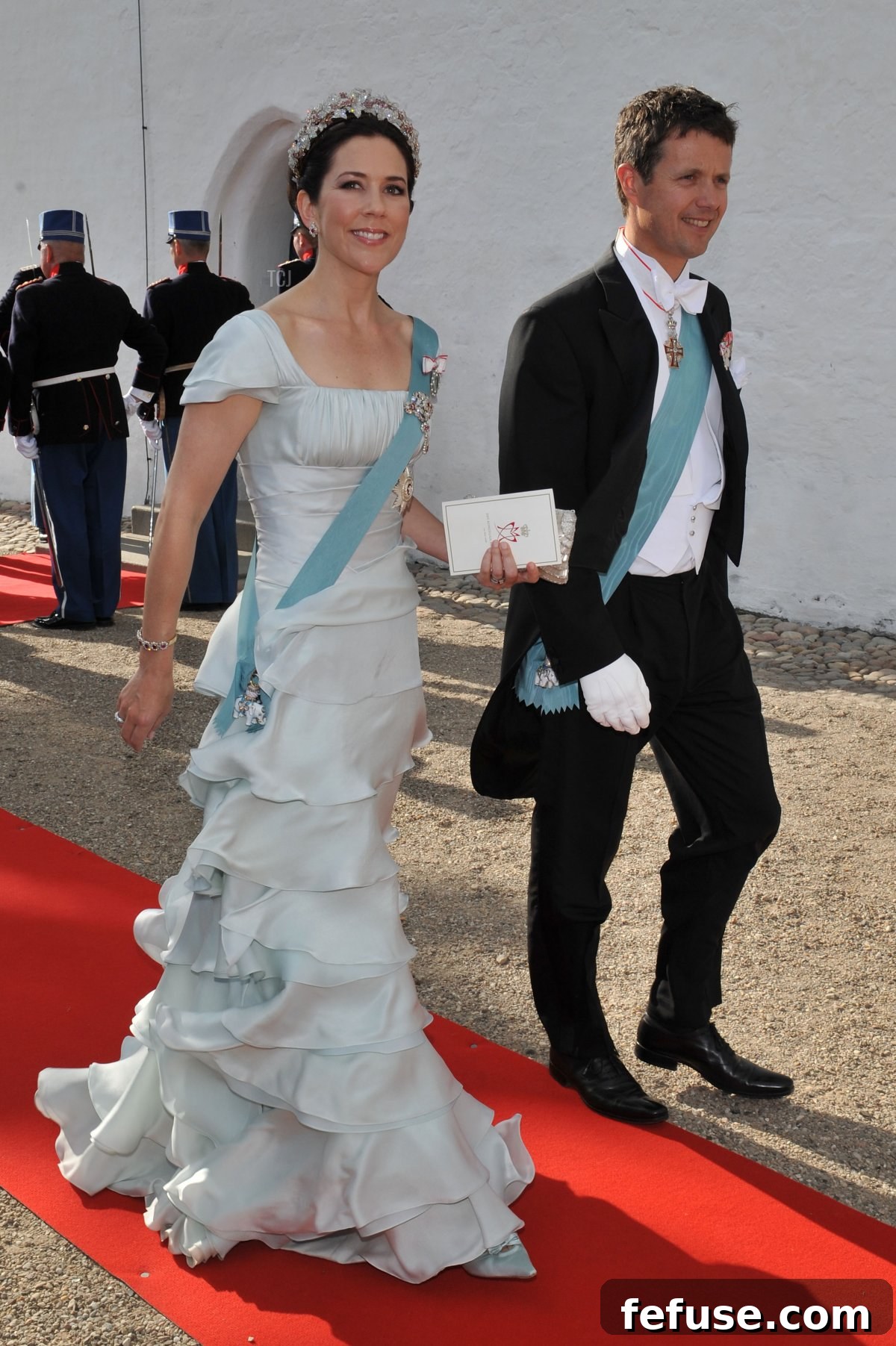 Crown Princess Mary showcasing the elegant ruby and diamond bangle bracelet from the Danish Ruby Parure on her right wrist