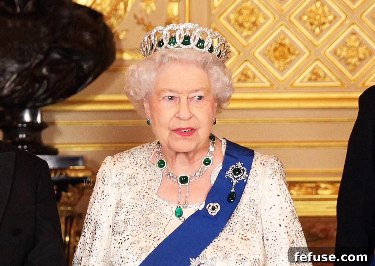 Sabina Coyne, President of Ireland Michael D. Higgins, Queen Elizabeth II and Prince Philip, Duke of Edinburgh pose for a photograph ahead of a State Banquet on April 8, 2014 in Windsor, England, showcasing the timeless elegance of royal jewelry.