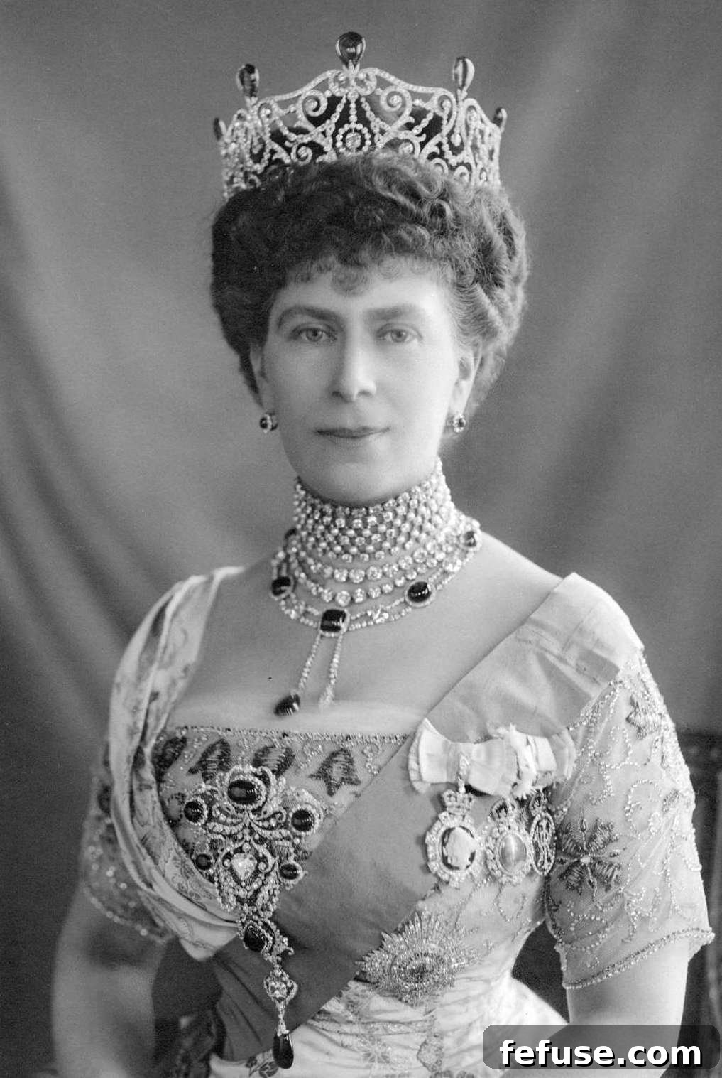 Queen Mary wears the magnificent Delhi Durbar Parure around 1911, featuring many of the historic Cambridge Emeralds in a grand display.