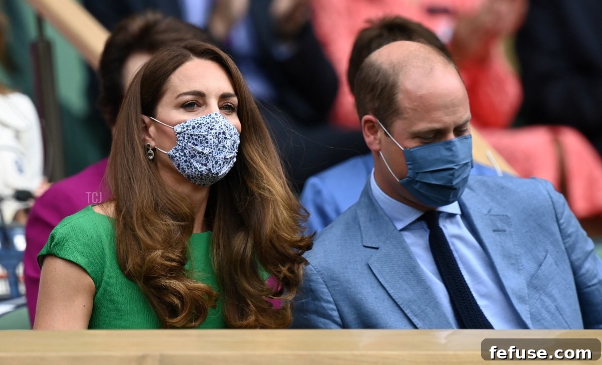 Britain's Catherine, Duchess of Cambridge and Britain's Prince William, Duke of Cambridge, wearing face masks, take their sets in the Royal box to watch the women's singles final on the twelfth day of the 2021 Wimbledon Championships at The All England Tennis Club in Wimbledon, southwest London, on July 10, 2021