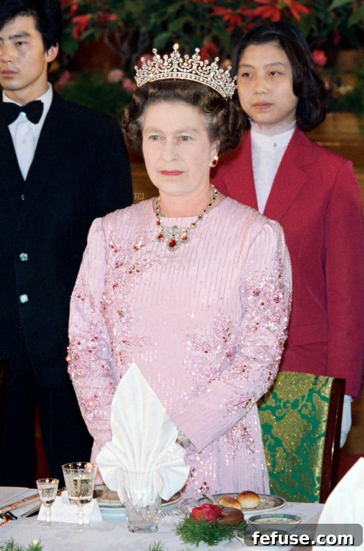 Queen Elizabeth II wears the Baring Ruby Necklace, Girls of Great Britain and Ireland Tiara, and Queen Mary’s Ruby Cluster Earrings at a banquet in China, October 1986