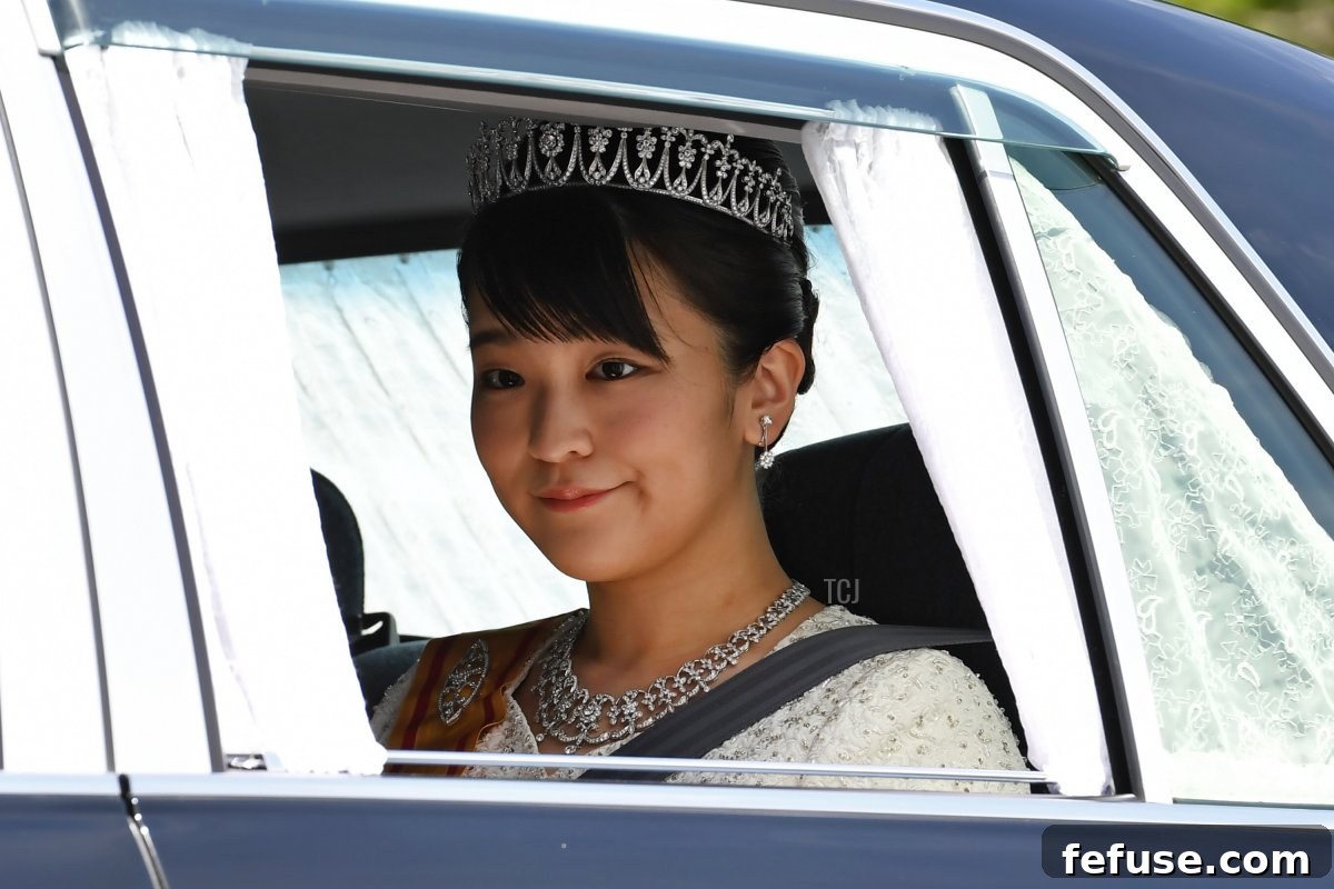 A vehicle carrying Japans Princess Mako, daughter of Crown Prince Akishino, leaves the Imperial Palace in Tokyo on May 1, 2019