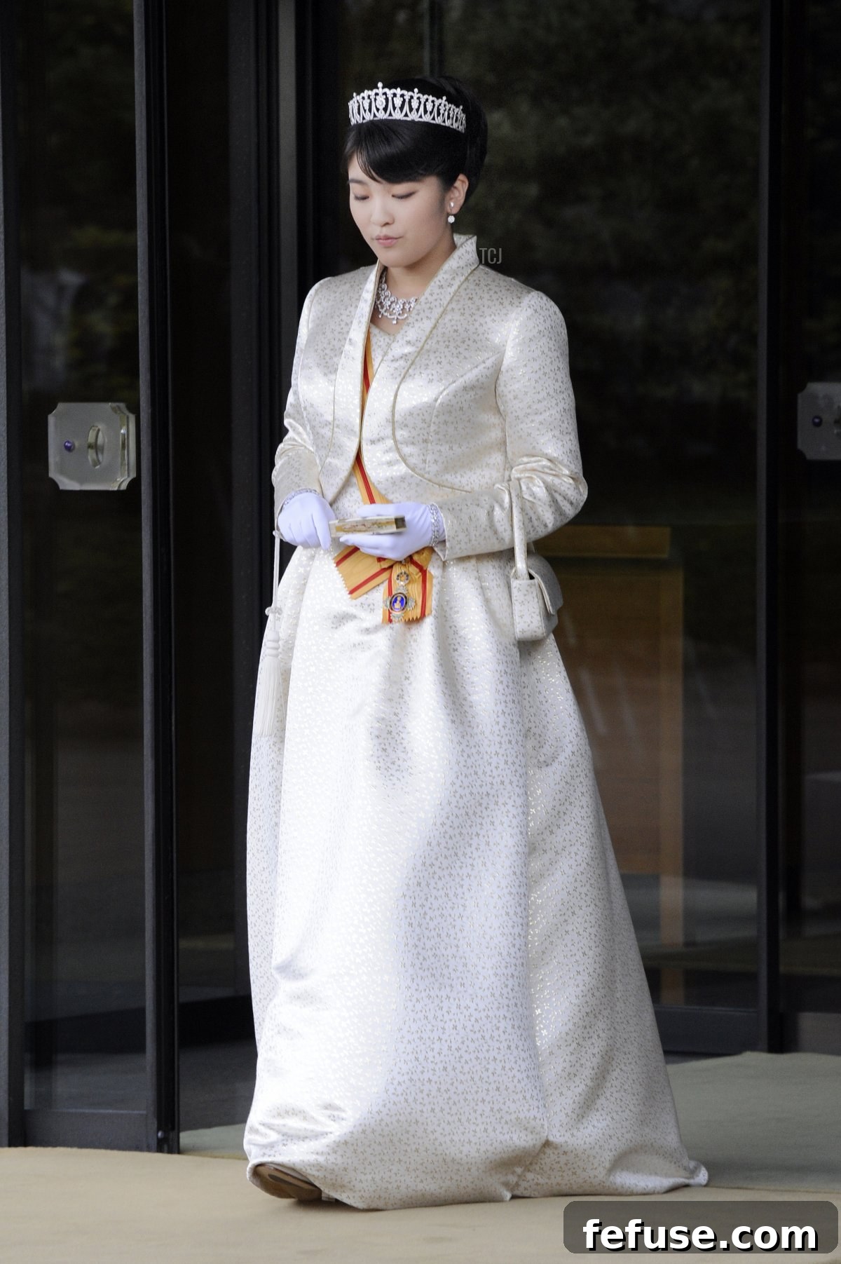 Japan's Princess Mako, the first daughter of Prince Akishino and Princess Kiko, in full dress leaves the Imperial Palace in Tokyo after meeting with the emperor and empress on October 23, 2011
