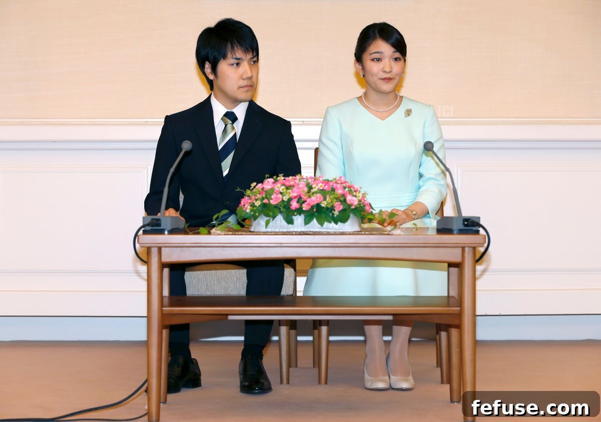 Princess Mako (R), the eldest daughter of Prince Akishino and Princess Kiko, and her fiancee Kei Komuro (L), take part in a press conference to announce their engagement at the Akasaka East Residence in Tokyo on September 3, 2017