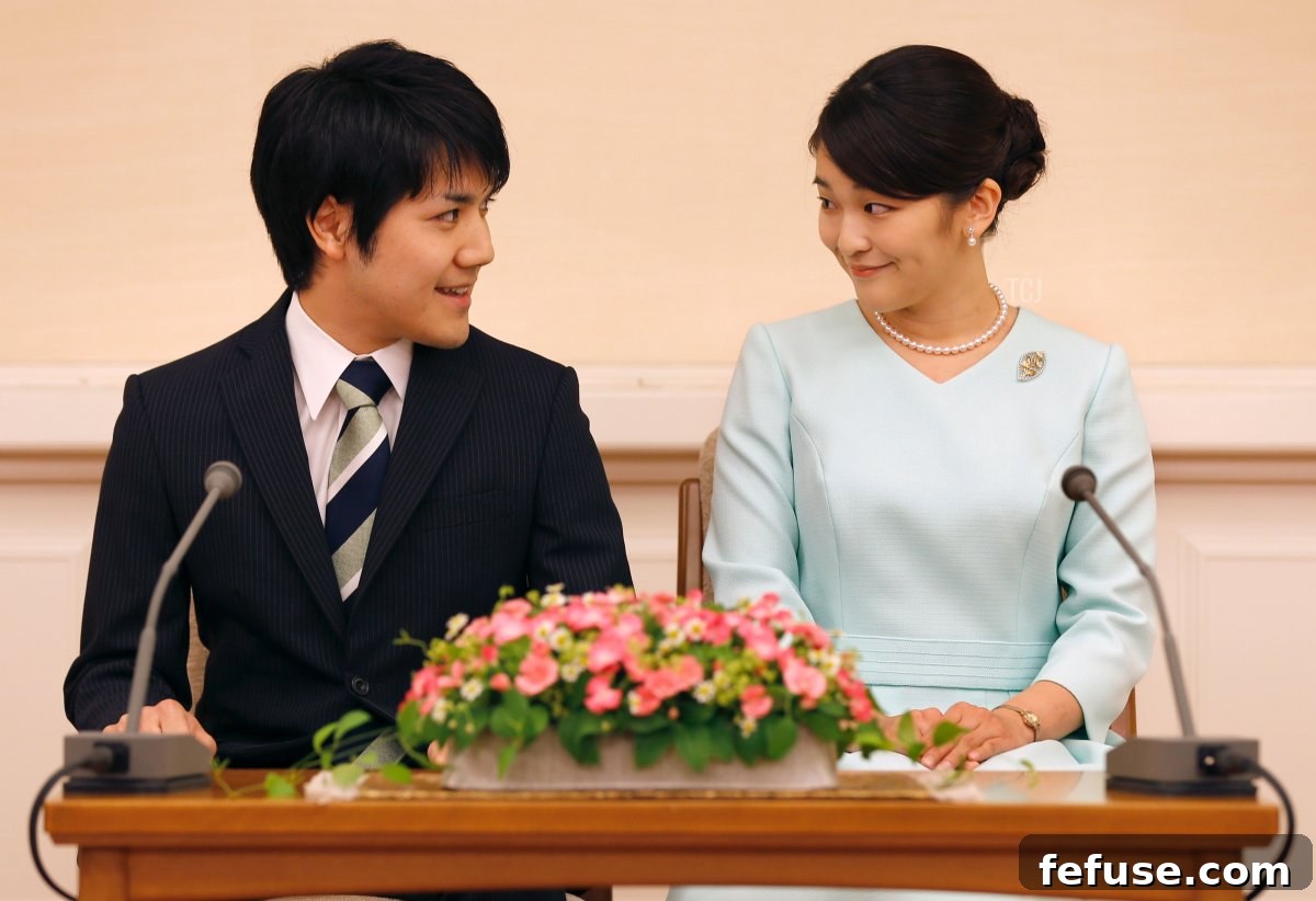 Princess Mako (R), the eldest daughter of Prince Akishino and Princess Kiko, and her fiancee Kei Komuro (L), smile during a press conference to announce their engagement at the Akasaka East Residence in Tokyo on September 3, 2017