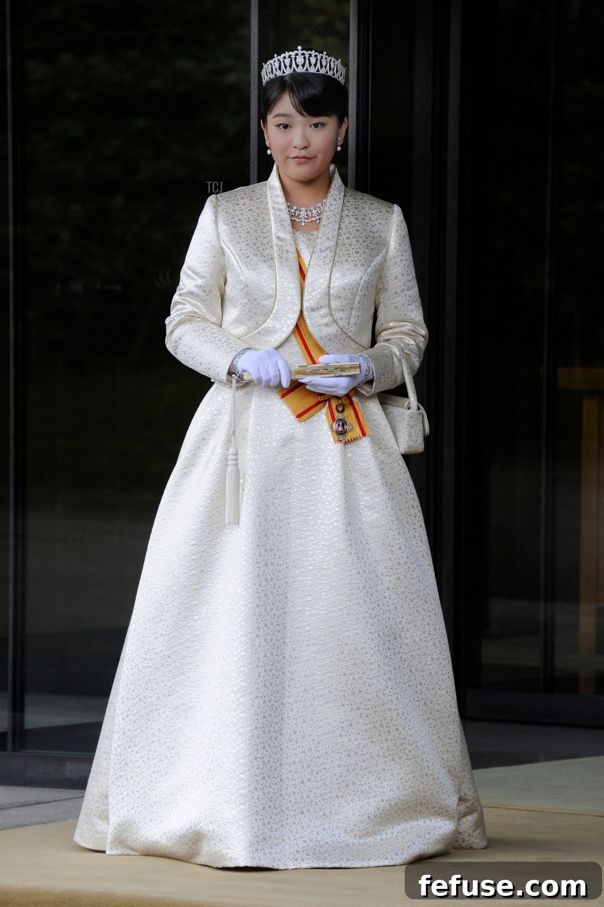 Japan's Princess Mako, the first daughter of Prince Akishino and Princess Kiko, in full dress leaves the Imperial Palace in Tokyo after meeting with the emperor and empress on October 23, 2011