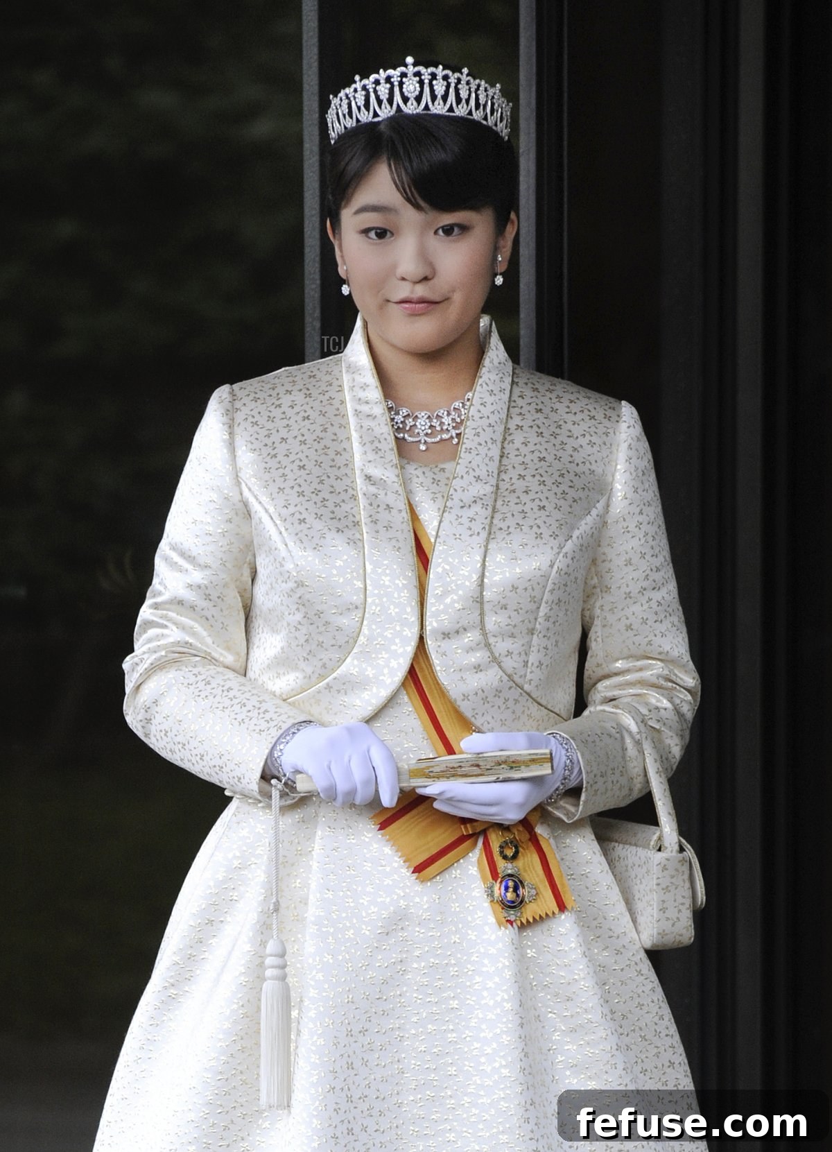 Japan's Princess Mako, the first daughter of Prince Akishino and Princess Kiko, in full dress leaves the Imperial Palace in Tokyo after meeting with the emperor and empress on October 23, 2011