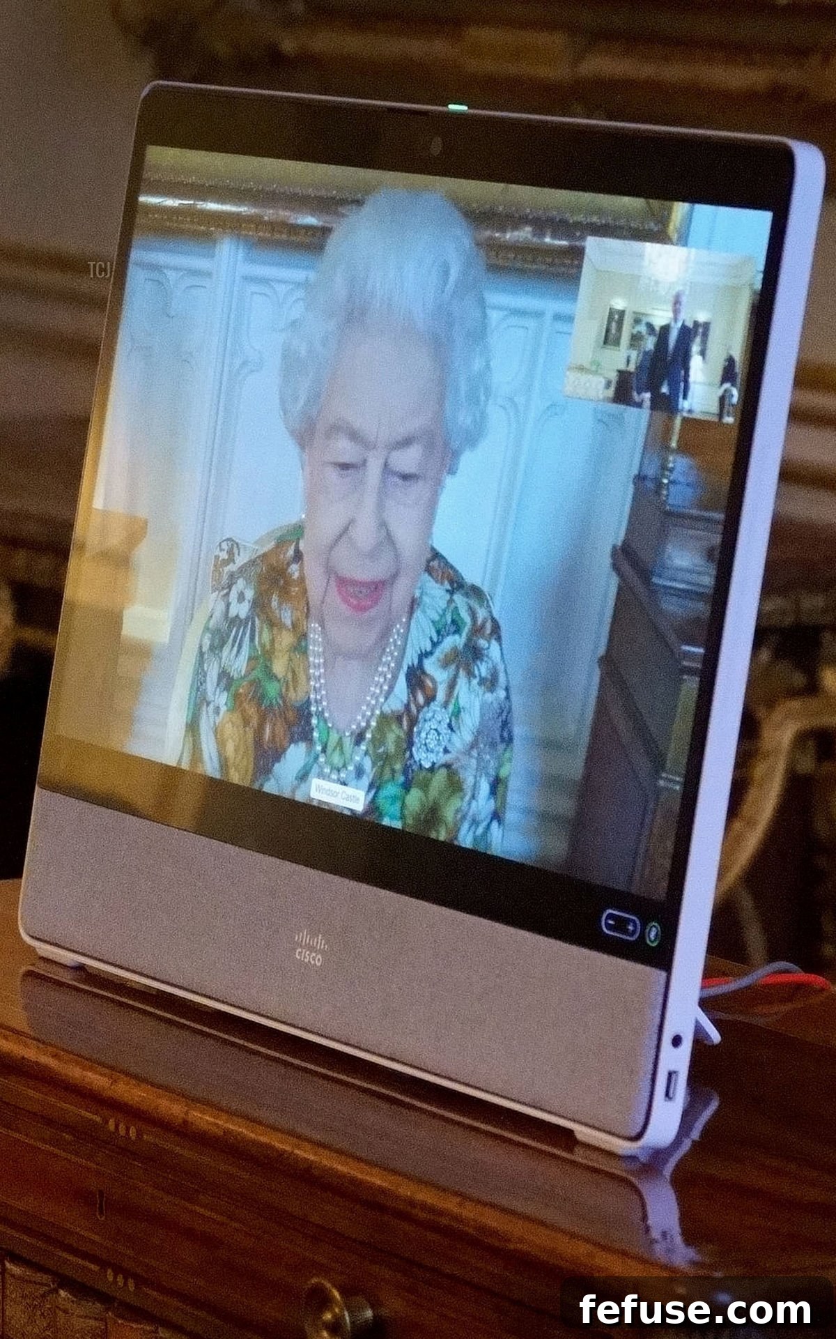Britain's Queen Elizabeth II appears on a screen via videolink from Windsor Castle, during a virtual audience to receive Estonia's Ambassador to the UK, Viljar Lubi, at Buckingham Palace in London on February 15, 2022