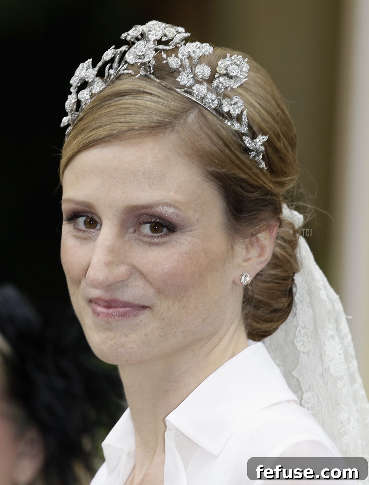 Princess Sophie of Prussia wearing the Isenburg Floral Tiara and an heirloom lace veil after her religious wedding ceremony in Potsdam, Germany.