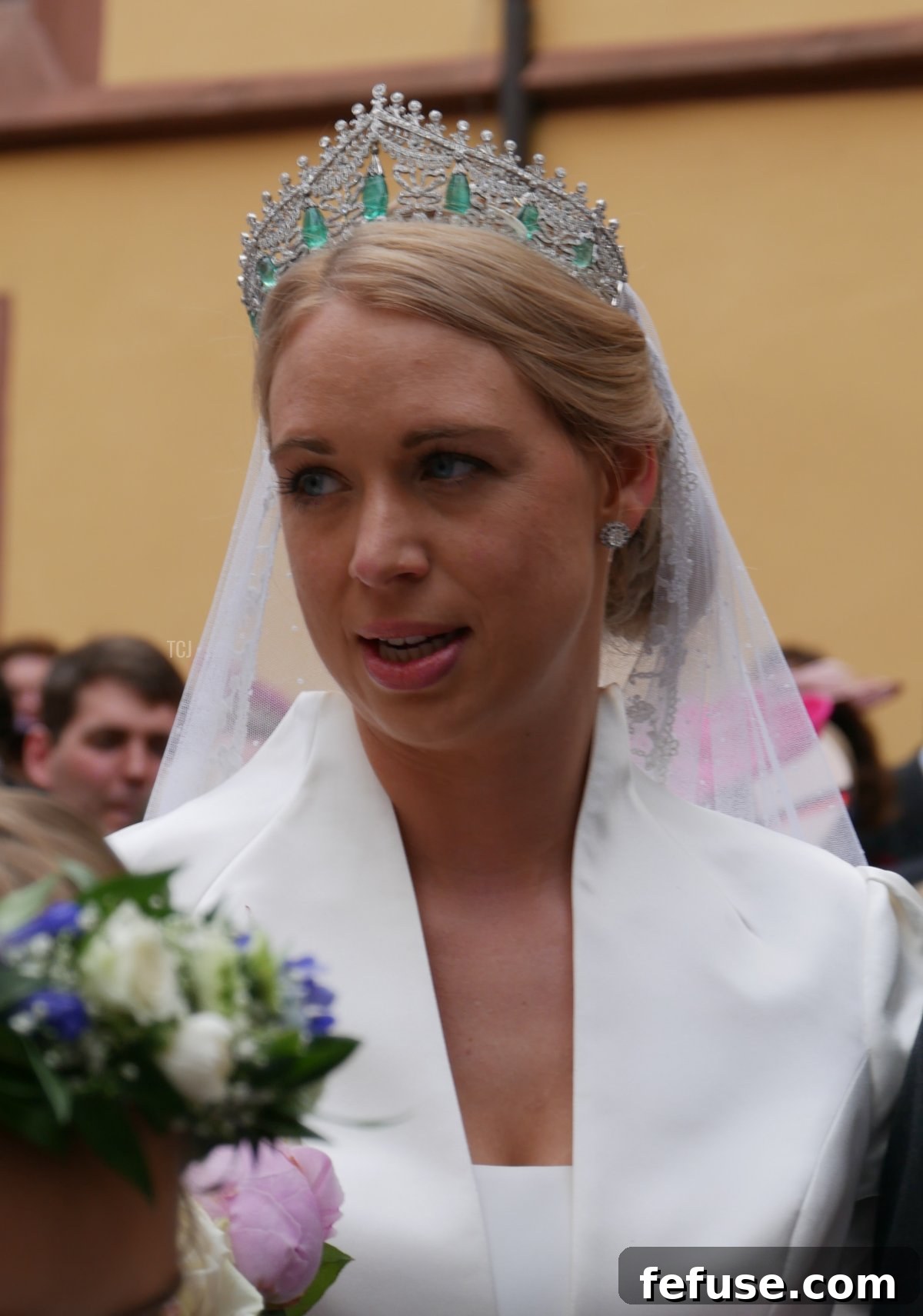Germany's Princely Emerald Bridal Crown 6 Close-up of Princess Amelie's stunning antique emerald and diamond tiara, showcasing intricate diamond work and cabochon emerald drops, securing her lace veil.