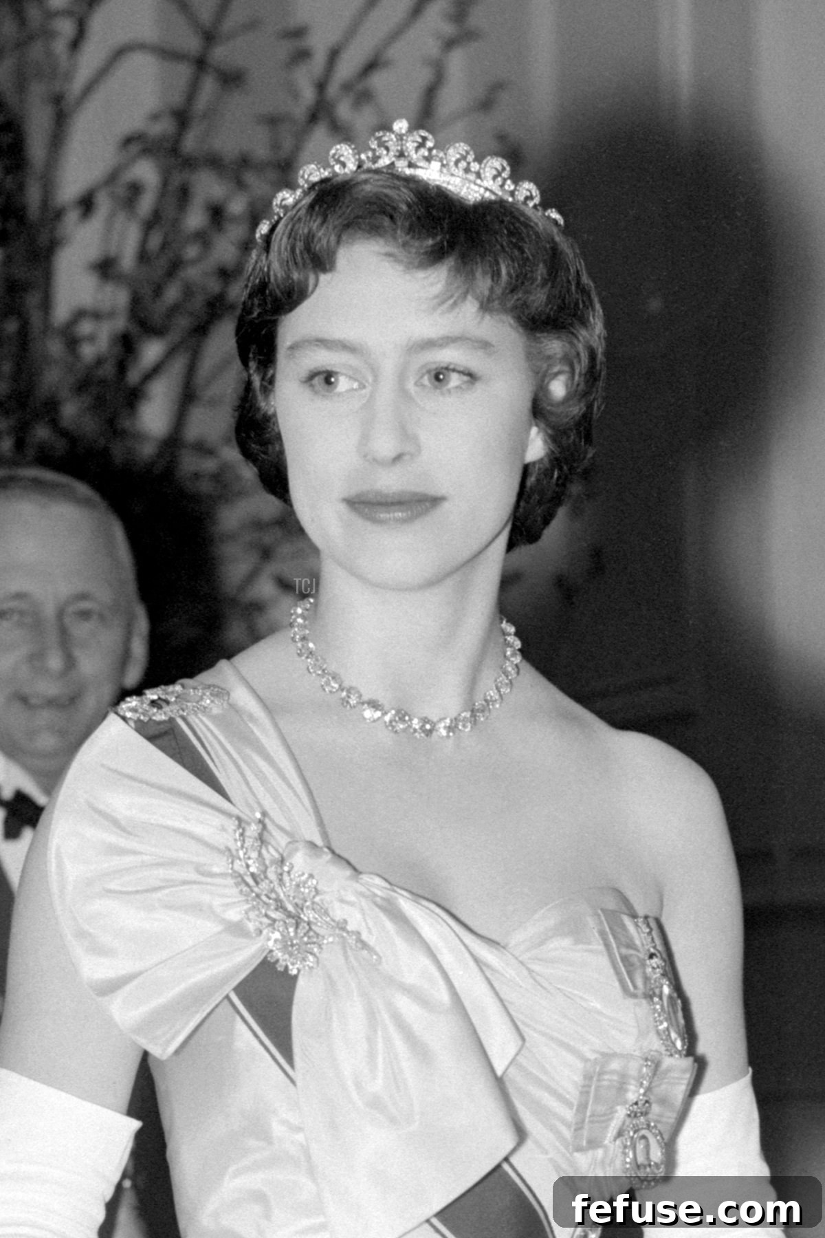 Princess Margaret in the procession to the dining room for the dinner to celebrate the 40th anniversary of the Royal Air Force at Fighter Command headquarters at Stanmore, Middlesex, April 1958