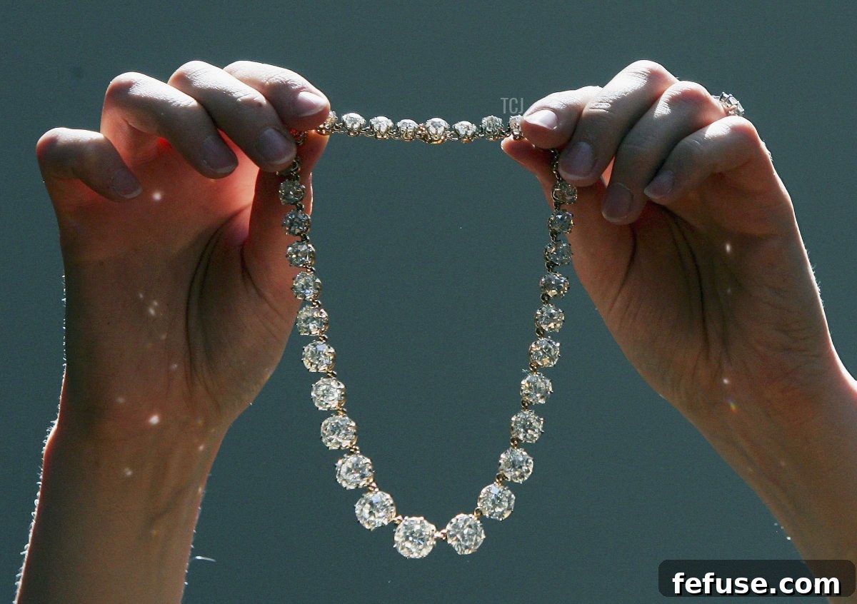 A jewellery specialist from Christie's holds Queen Mary's Diamond Riviere during a photocall of jewellery and works of art from the Collection of Her Royal Highness The Princess Margaret, Countess of Snowdon at Christie's on June 9, 2006 in London, England