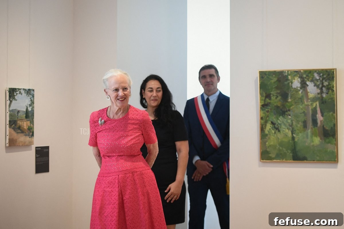 Queen Margrethe II of Denmark (L) inaugurates her works, flanked by Cahor's mayor Jean-Marc Vayssouze-Faure (R) and the museum director Rachel Amalric (C) at the Henri Martin museum in Cahors, southern France, on August 17, 2022