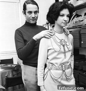 Kenneth Jay Lane with a model showcasing his jewelry in the 1960s