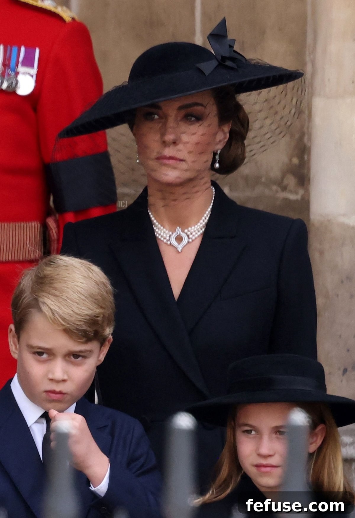 Catherine, Princess of Wales, with Prince George and Princess Charlotte, following Queen Elizabeth II's State Funeral Service, wearing the Queen's Bahrain Pearl Drop Earrings and a four-row pearl choker.