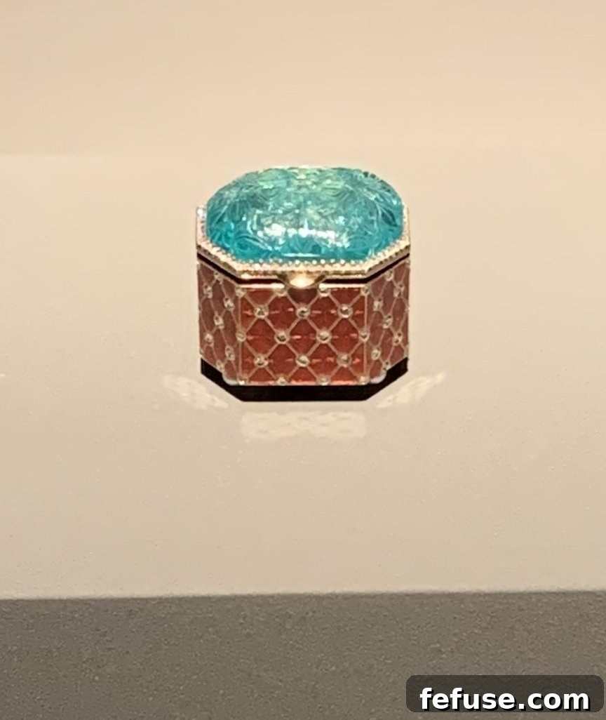 Unique Fabergé gold, diamond, pearl, and enamel box featuring an antique Indian carved emerald top, exemplifying East-West artistic fusion