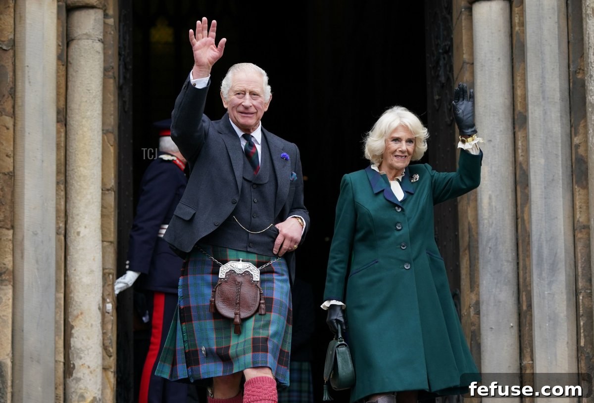 King Charles III and Camilla, Queen Consort, waves as they leave Dunfermline Abbey, after a visit to mark its 950th anniversary, and after attending a meeting at the City Chambers in Dunfermline where the King formally marked the conferral of city status on the former town on October 3, 2022 in Dunfermline, Scotland