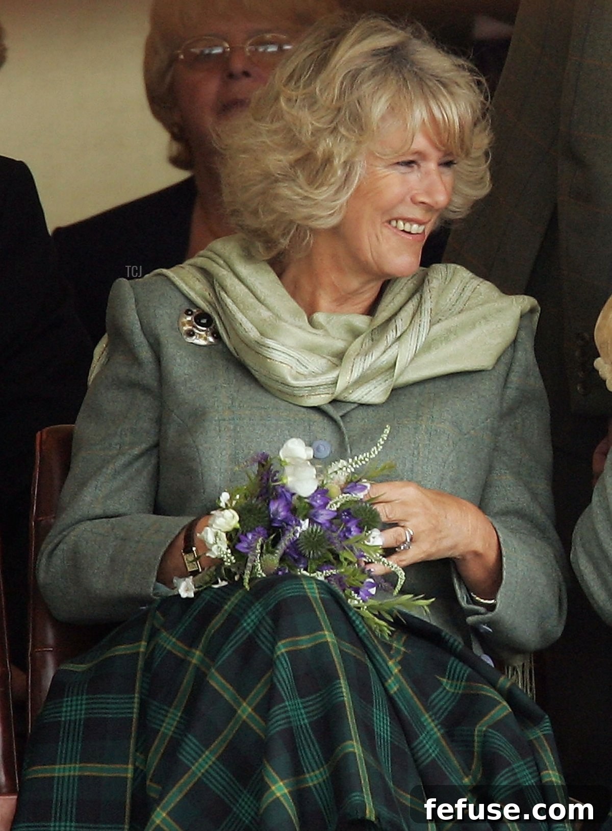Prince Charles, the Prince of Wales, and his wife Camilla, the Duchess of Cornwall, in their role as the Duke and Duchess of Rothesay, enjoy a drink of whisky from a Quaich given to them as a wedding gift during the 2005 Mey Games at Queens Park in Mey on August 6, 2005 in Caithness, Scotland