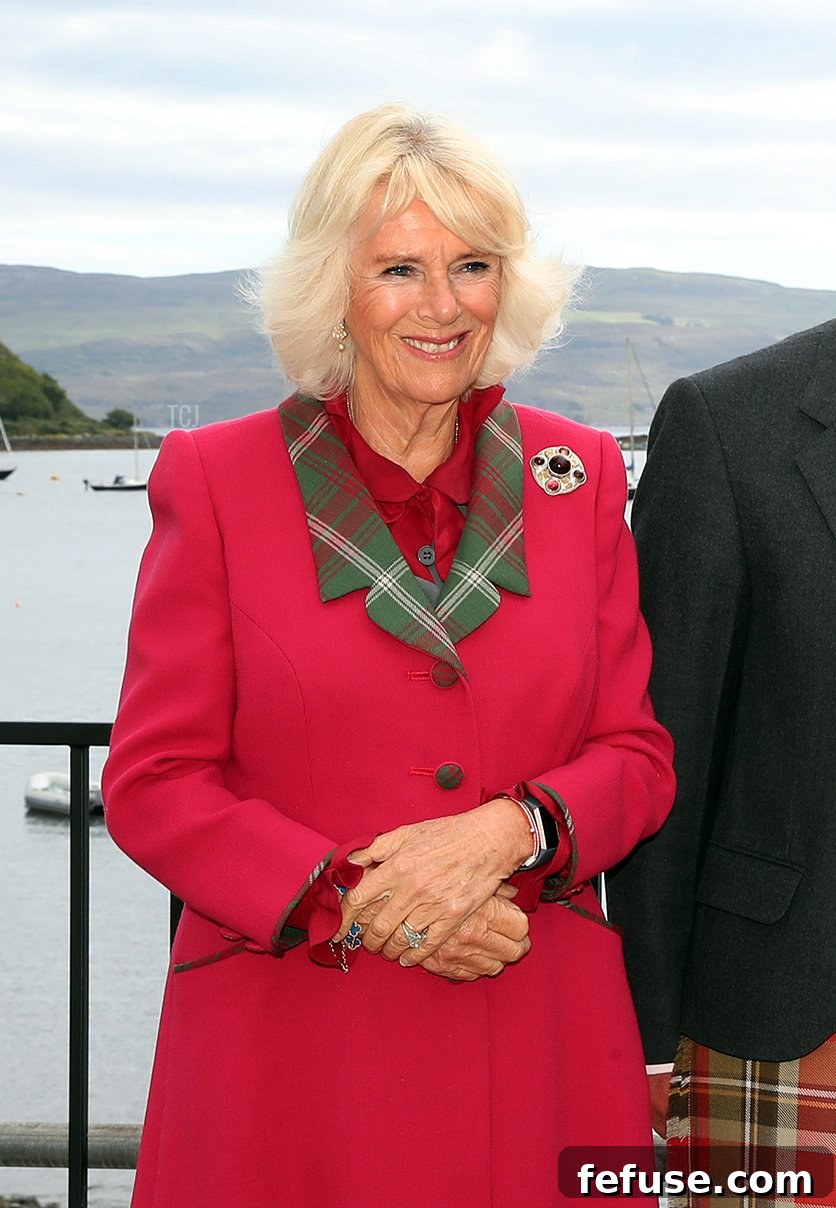 Prince Charles, Prince of Wales and Camilla, Duchess of Cornwall, known as the Duke and Duchess of Rothesay when in Scotland speak to renowned Gaelic singer, Robert Robertson after he'd performed a couple of songs for the couple during a visit to Portree on the Isle of Skye on September 16, 2021 in Portree, Scotland
