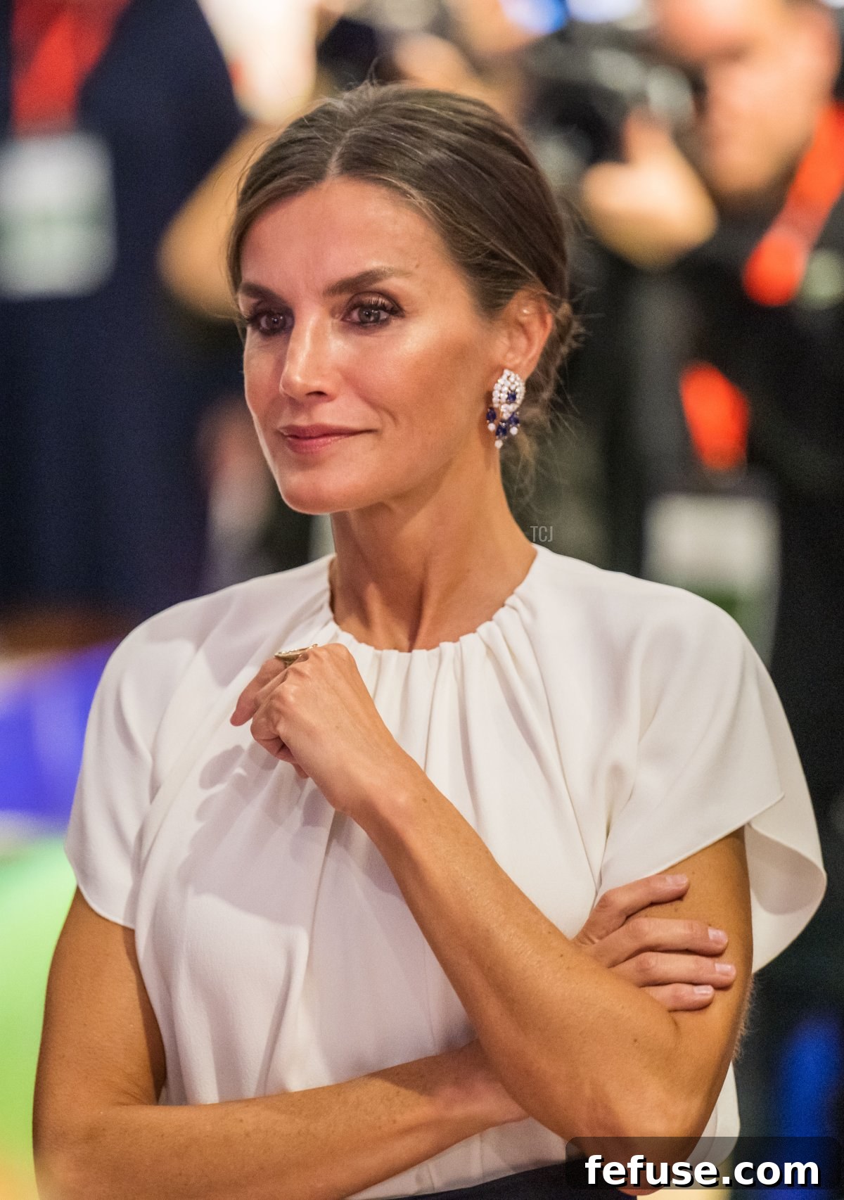 Queen Letizia of Spain showcasing her Karen Hallam ring and sapphire earrings at the 2022 Frankfurt Book Fair.