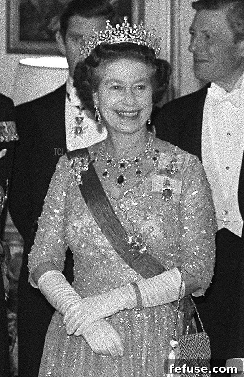 French President Francois Mitterrand (C), his wife Danielle and Queen Elizabeth II arrive at the French Ambassador's residence in London , October 25, 1984 where the President held a state banquet in honour of the Queen