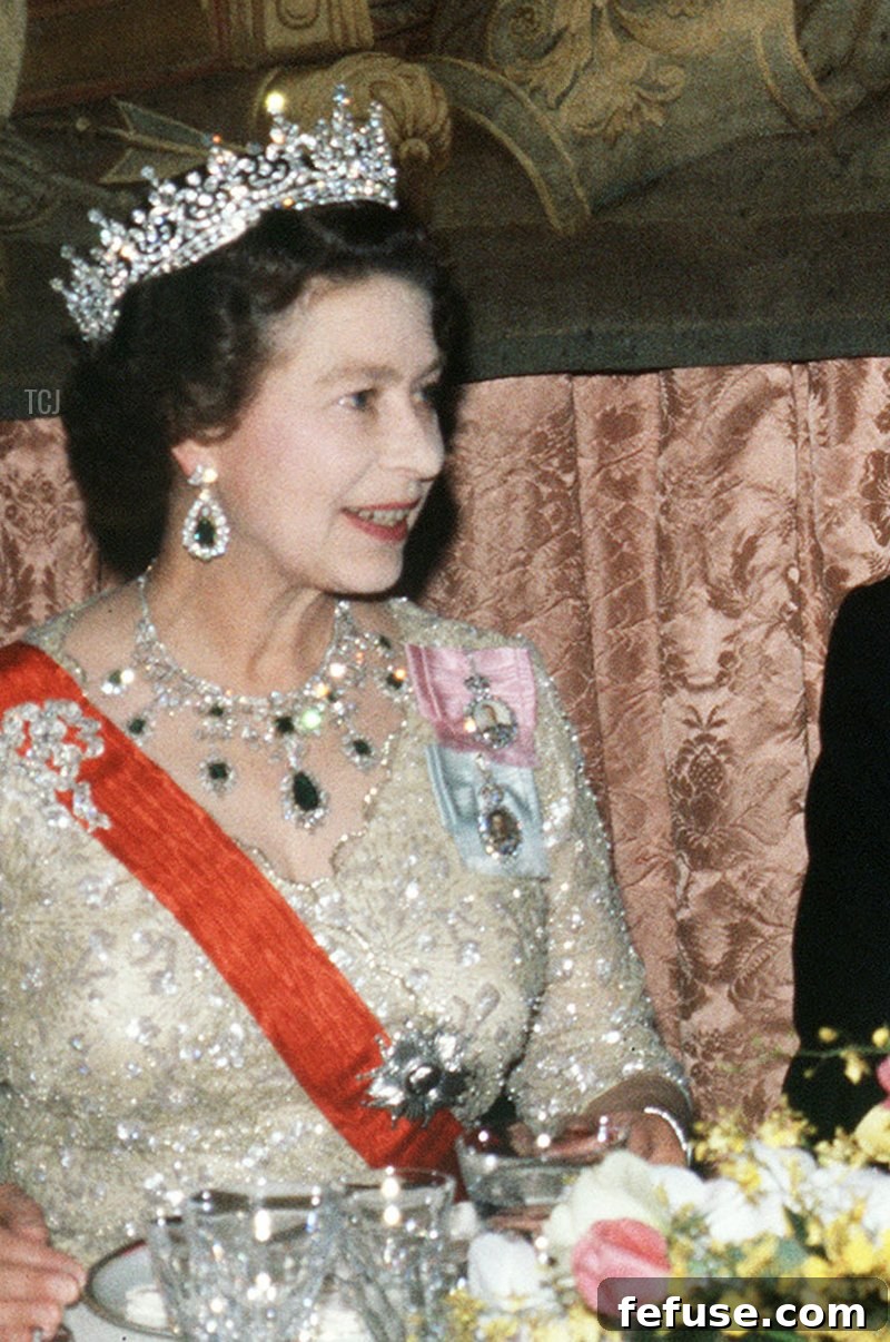 Queen Elizabeth II and her husband the Duke of Edinburgh attend an official banquet in honor of François Mitterrand, at the French embassy in London, 25 October 1984, during the state visit of the French President in the United Kingdom