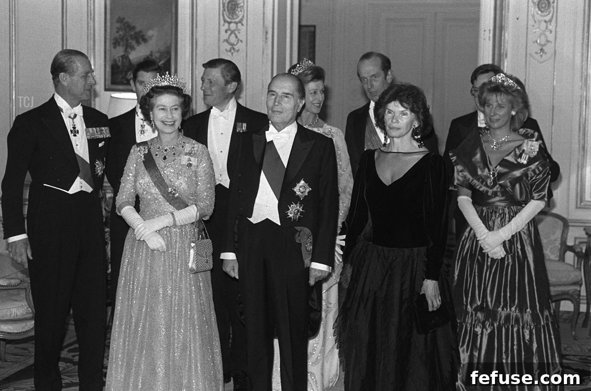 French President Francois Mitterrand (C), his wife Danielle and Queen Elizabeth II arrive at the French Ambassador's residence in London , October 25, 1984 where the President held a state banquet in honour of the Queen