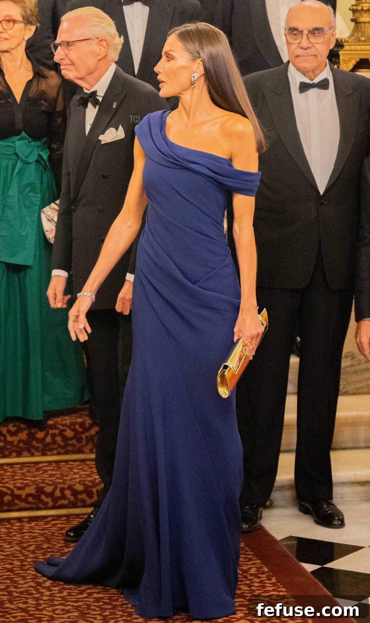 Queen Letizia Dazzles in Diamonds and Sapphires in Barcelona 7 Details of Queen Letizia's Carolina Herrera blue gown with gold accessories, November 4, 2022